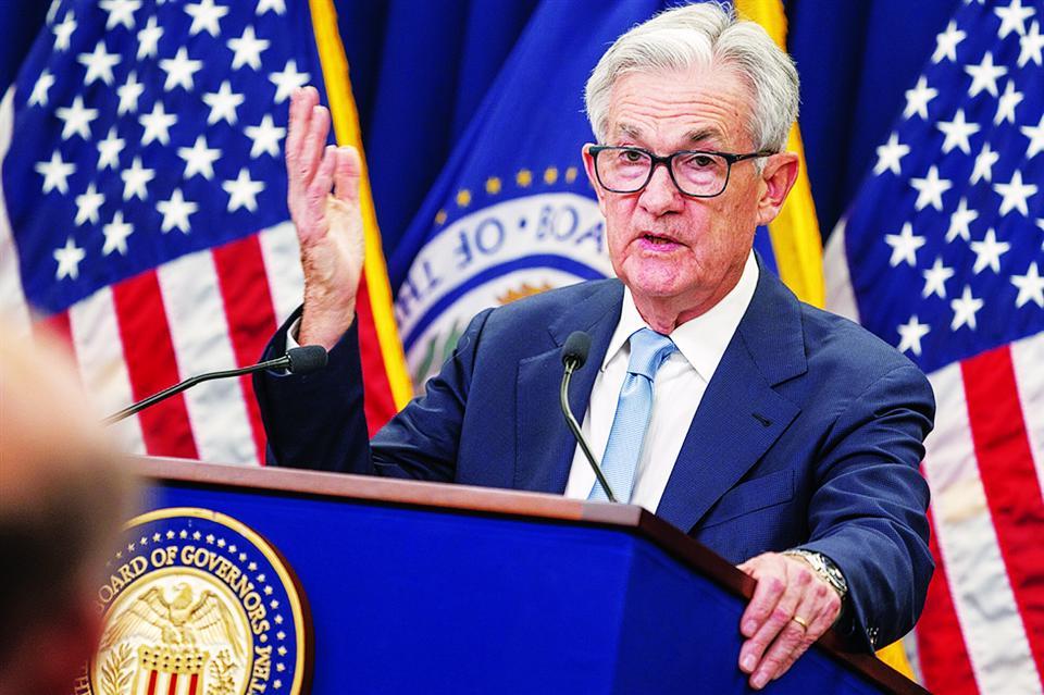 Chủ tịch Fed Jerome Powell trả lời báo giới sau cuộc họp chính sách ngày 22/3. Ảnh: EPA